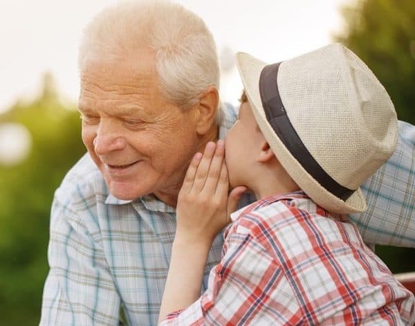 boy-whispering-to-grandpa-600x471 (1).jpg