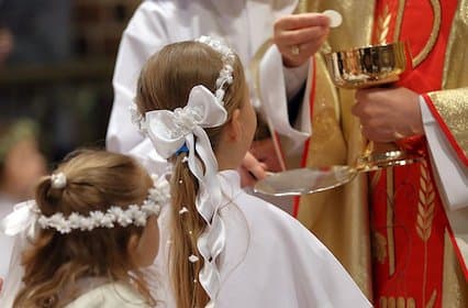 web3-children-going-to-the-first-holy-communion-0a-shutterstock_587731196 (1).jpg